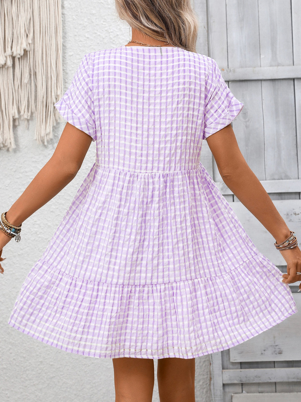 Plush Fashion Hub plaid V-neck mini dress with ruffle hem, featuring a chic plaid pattern and stylish fit.