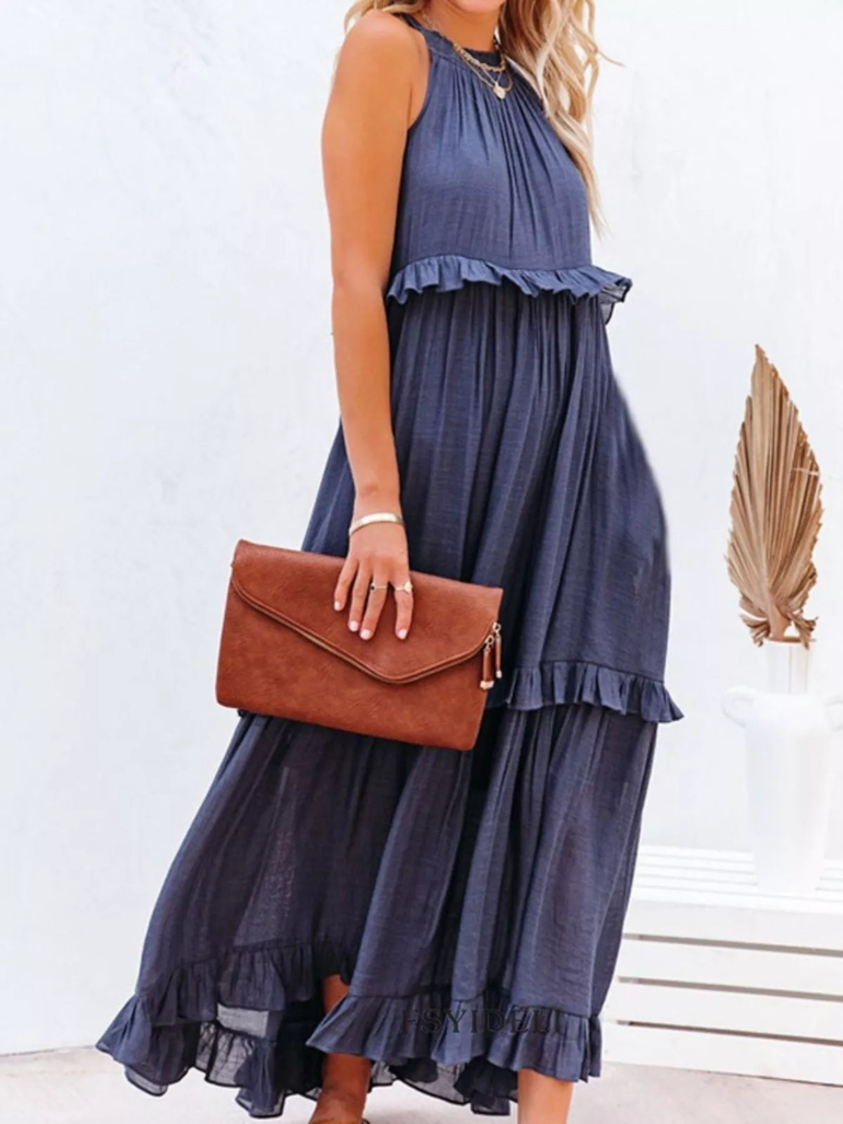 Ruffled tiered sleeveless maxi dress by Plush Fashion Hub featuring flowing fabric and elegant ruffle details.
