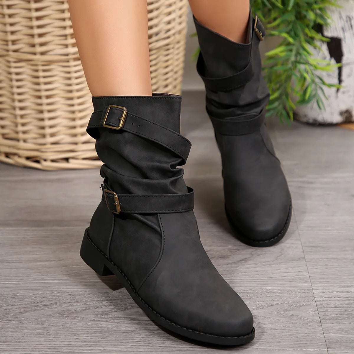 Mid-calf buckle strap boots by Trendsi, featuring sturdy leather shoes with buckle details and a chunky heel.