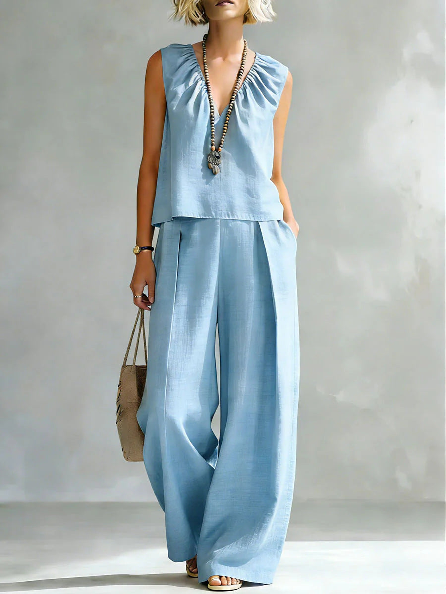 Women's sleeveless cotton-linen shirt and pants set by FitiqueFit, casualwear, featuring lightweight fabric and relaxed fit in natural tones.