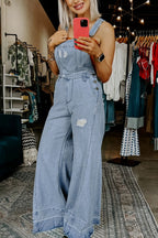 Women's distressed wide leg denim overalls with casual relaxed fit, featuring distressed details and adjustable straps.