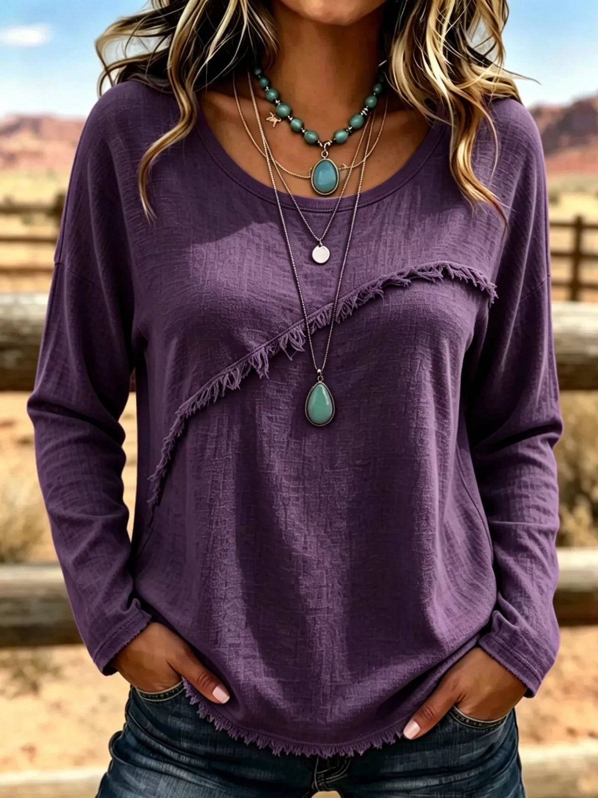 Plus size long sleeve T-shirt by Trendsi featuring fringe details and casual style, shown in a vibrant color on a model.