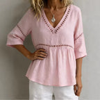 Women's V-neck hollow-out fringe cotton-linen top by FitiqueFit, featuring a casual V-neck design with fringe and breathable fabric details.
