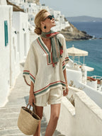 Women's casual V-neck top and shorts set by FitiqueFit, featuring a relaxed fit with soft fabric in neutral tones.