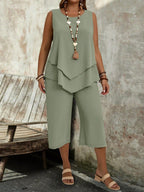 Casual solid-colored sleeveless top and cropped pants two-piece set by Plush Fashion Hub, perfect for comfortable everyday wear.