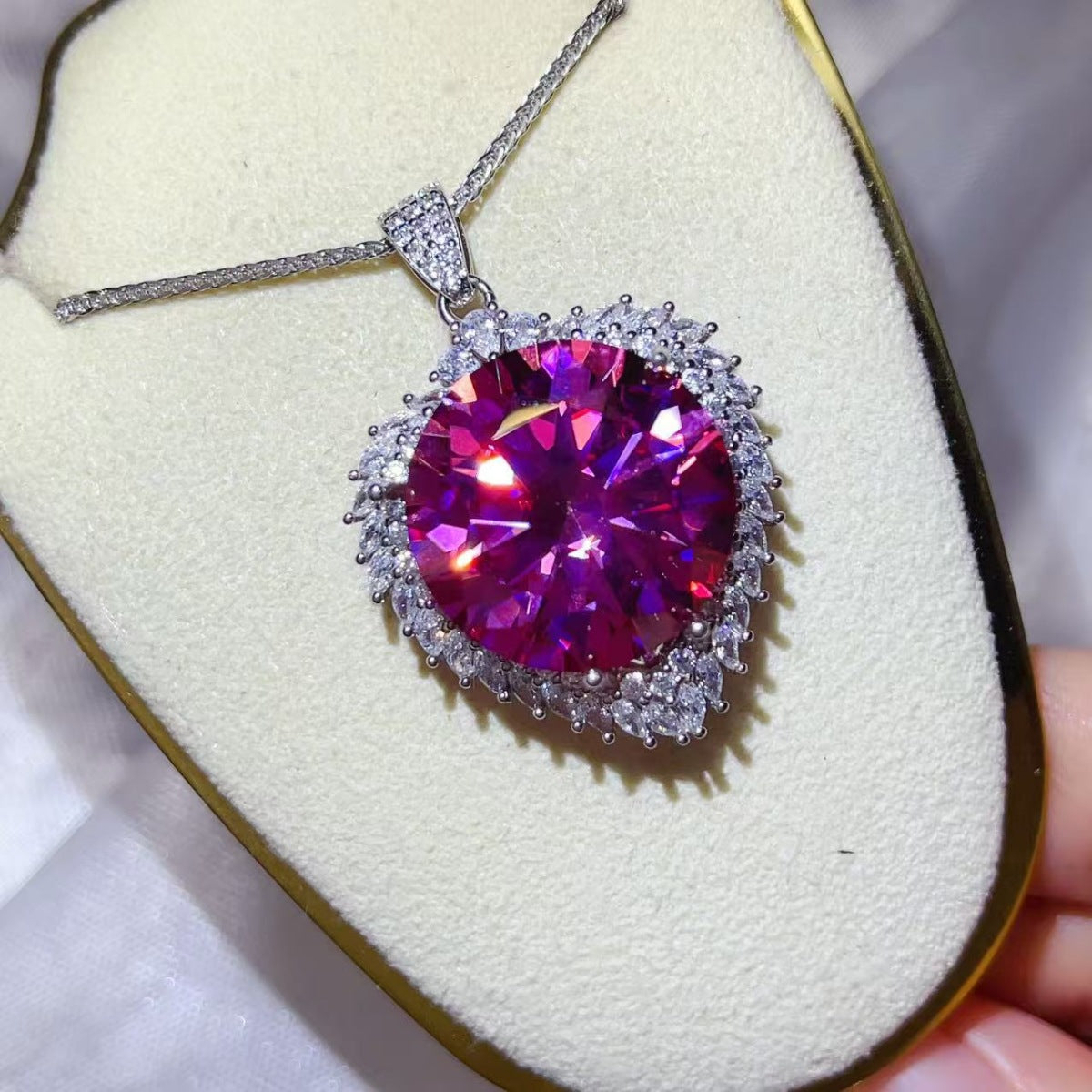 20 carat moissanite pendant necklace in sterling silver with a sleek chain, showcasing a sparkling center stone and elegant design.