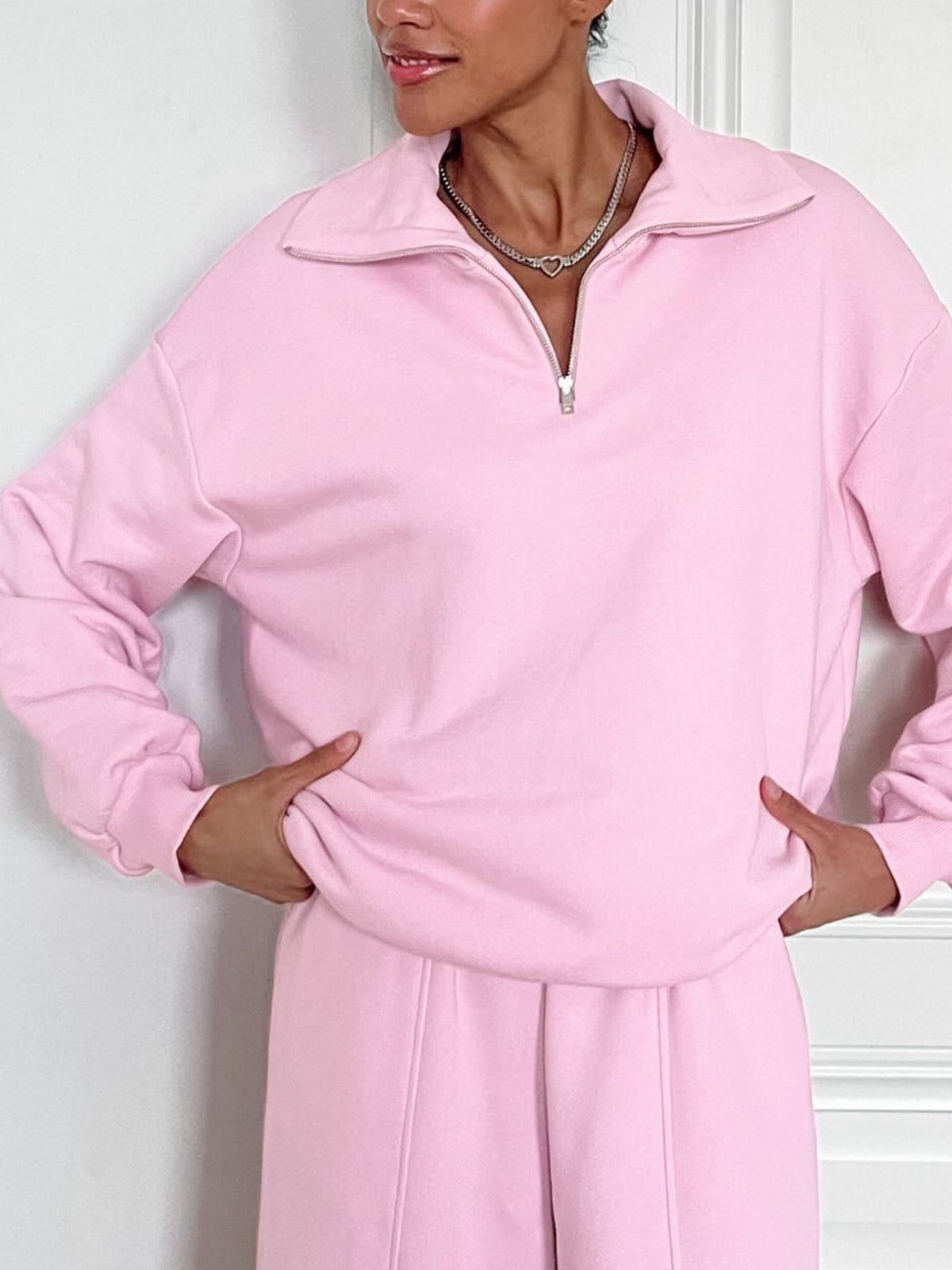Women’s quarter zip long sleeve loungewear set in a plush two-piece tracksuit, featuring soft fabric and comfortable fit.
