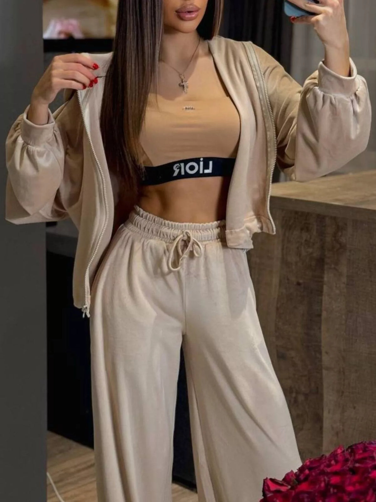 Plush Fashion Hub zip-up cropped outerwear and matching pants set, featuring a stylish athletic-inspired design and comfortable fit.