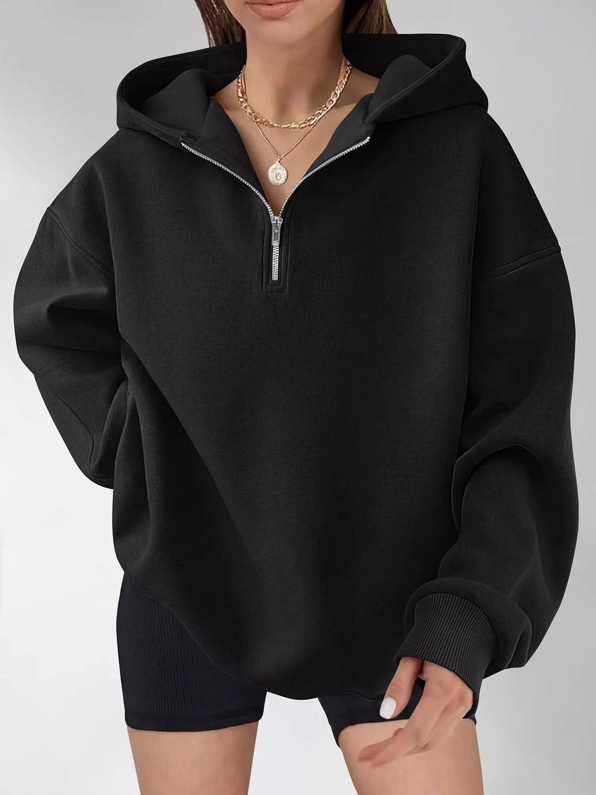 Oversized quarter-zip hoodie from Trendsi, featuring a relaxed fit and soft fabric, shown in a casual front view.