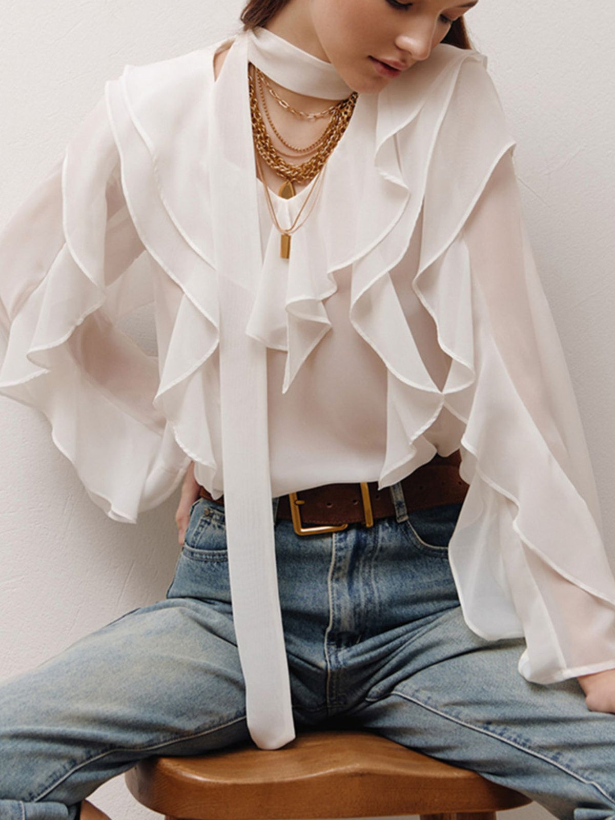 Elegant chiffon blouse with ruffle trim and tie neck, featuring a stylish, flowy design from Plush Fashion Hub.