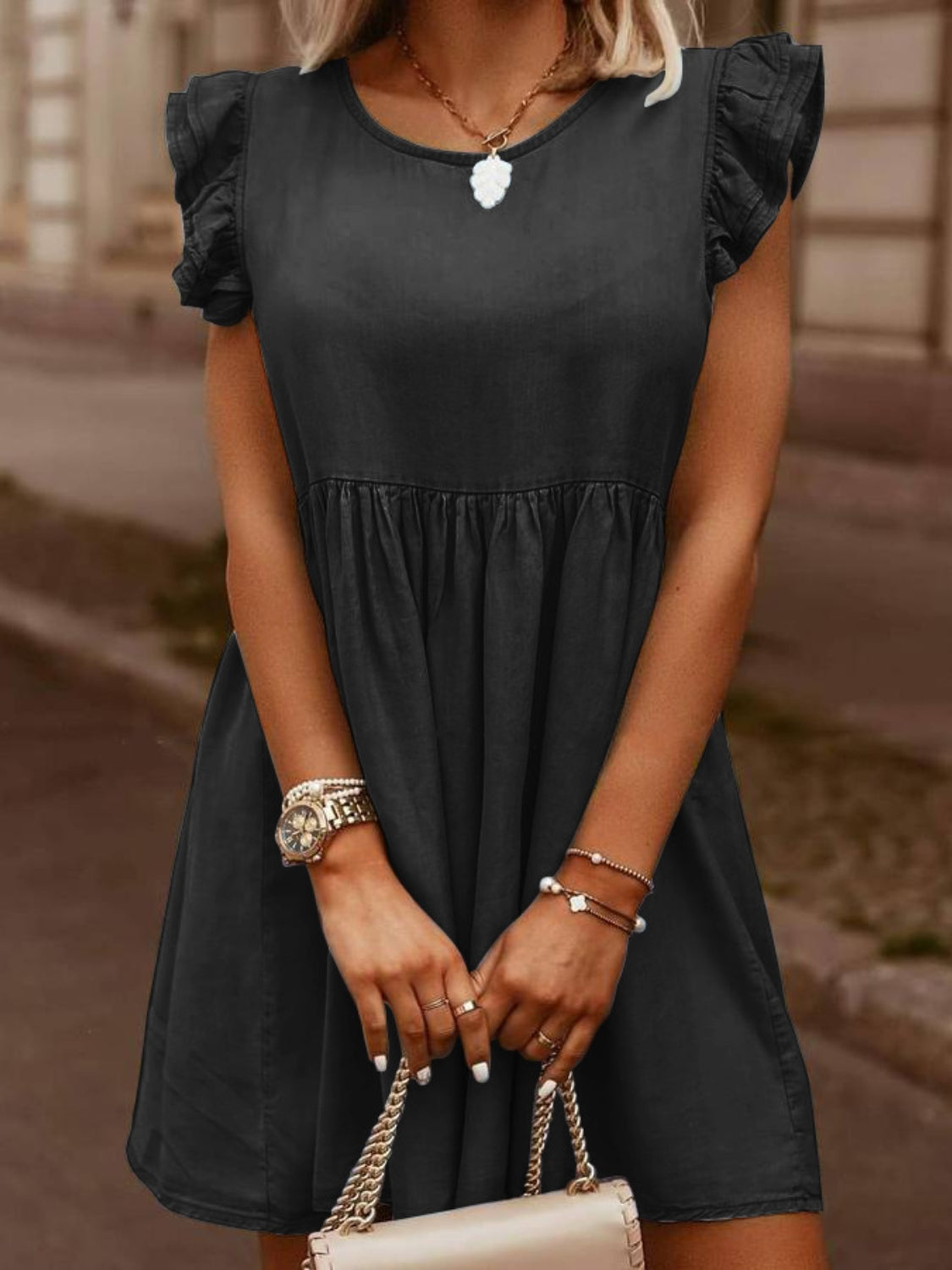 Full size ruffled round neck cap sleeve denim dress by Plush Fashion Hub, showcasing its stylish design and ruffled neckline.