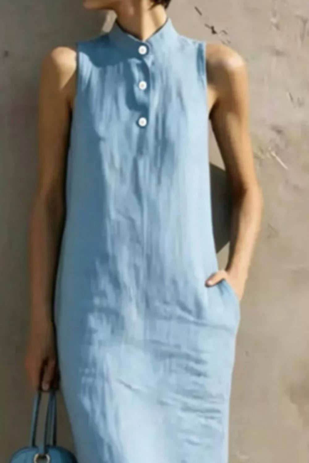Casual sleeveless midi dress by Plush Fashion Hub featuring button details and a relaxed fit, perfect for everyday wear.