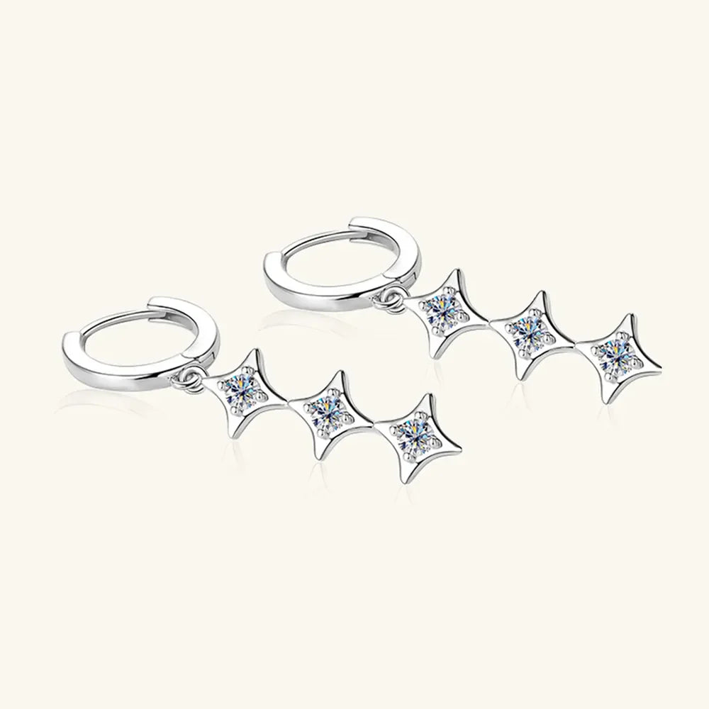 Sterling silver geometric moissanite earrings with a modern design, sparkling stone accents, and a polished finish.