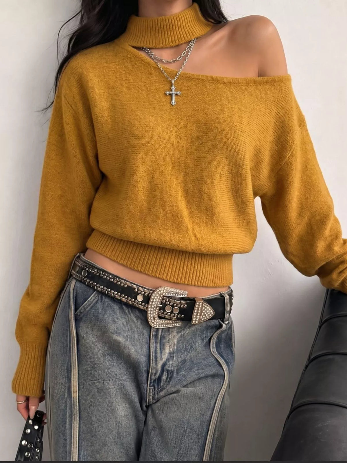 Cold-shoulder dropped shoulder sweater from Trendsi, featuring a cozy knit design with stylish cut-out shoulders and relaxed fit.