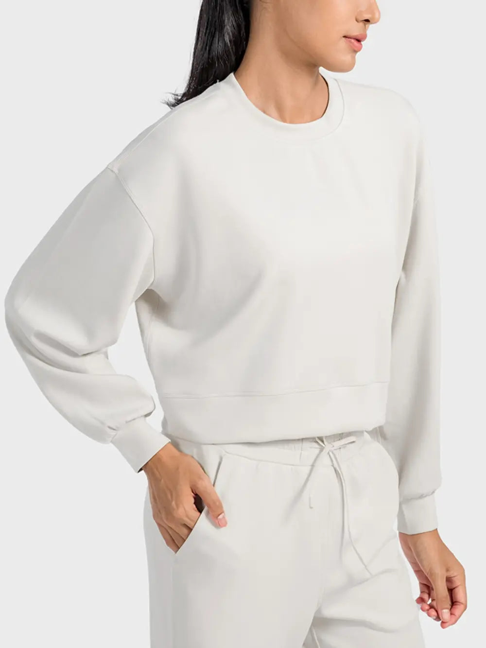 Plush Fashion Hub Millennia round neck drop shoulder sports top, soft fabric, and sporty design, ideal for active wear.