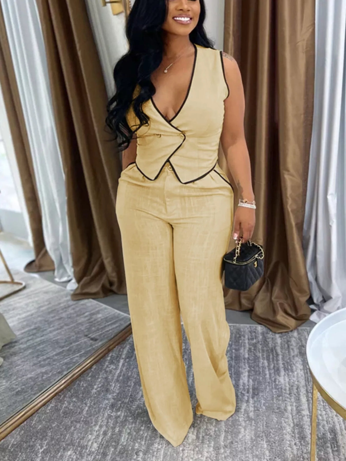 Trendsi contrast trim sweater vest and wide-leg pants two-piece set, featuring a stylish sweater with bold trim details and matching flowy pants.