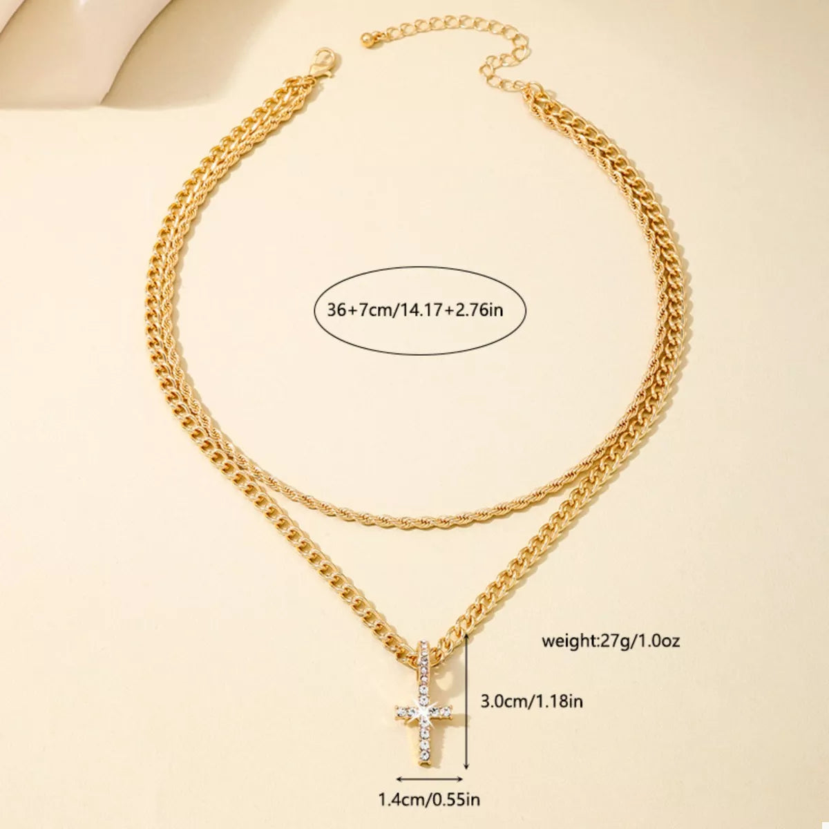 Layered gold chain cross pendant necklace from Plush Fashion Hub, showcasing multiple gold chains with a cross pendant.