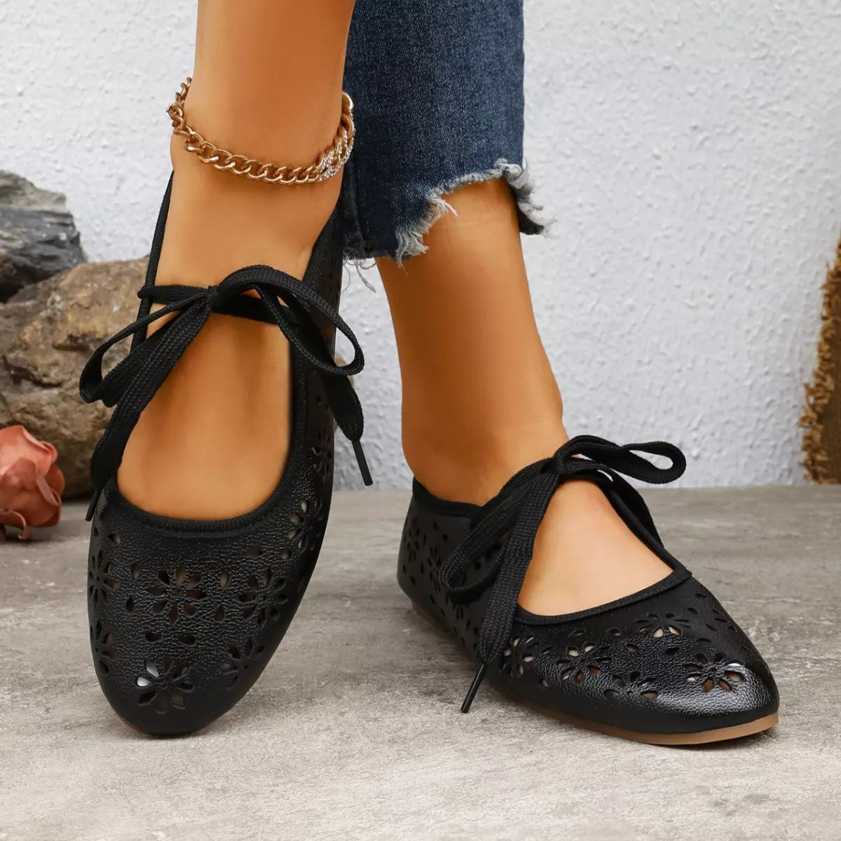 Floral cutout tied slip-on sandals by Plush Fashion Hub, featuring open toes and decorative floral accents.