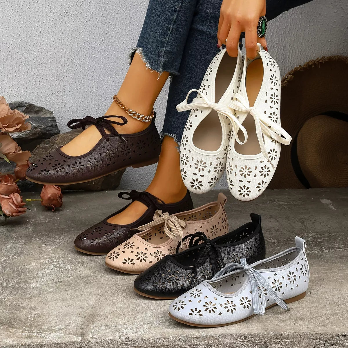 Floral cutout tied slip-on sandals by Plush Fashion Hub featuring open toes and decorative floral cutouts.