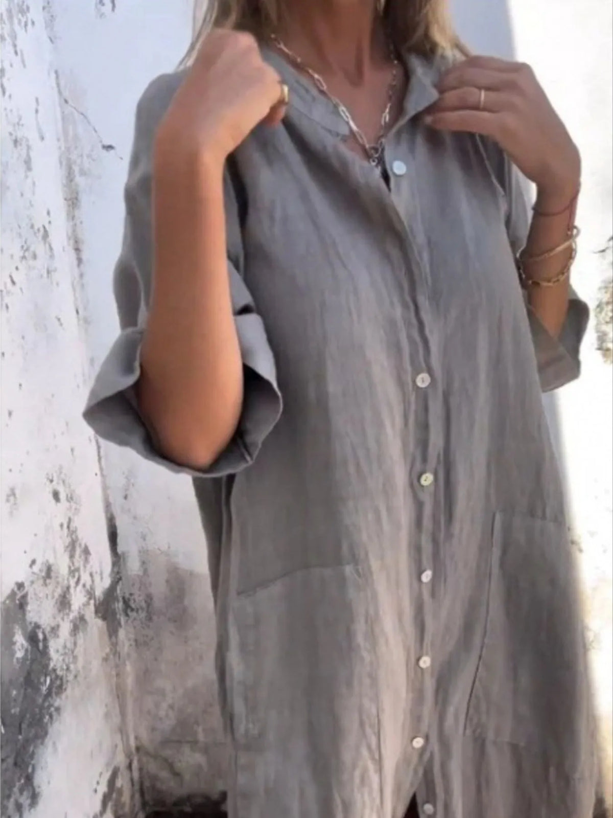 Plus size casual linen button-down shirt dress by Trendsi, featuring a relaxed fit with long sleeves and a collared neckline.