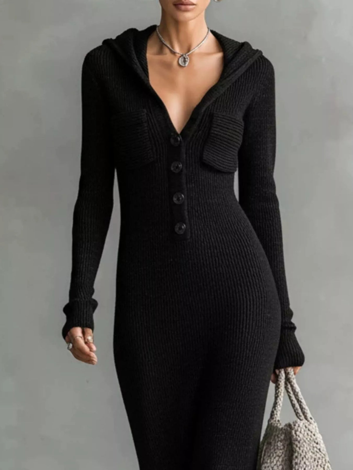 Knit hooded maxi dress by Trendsi featuring button placket and side pockets, shown in a cozy, stylish design.