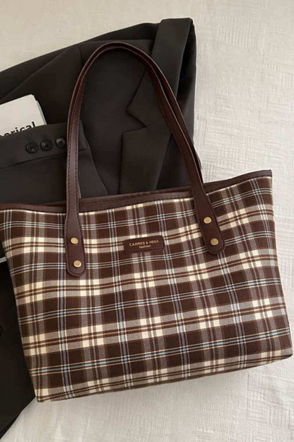 Plaid leather tote bag for women with chic design and spacious interior.