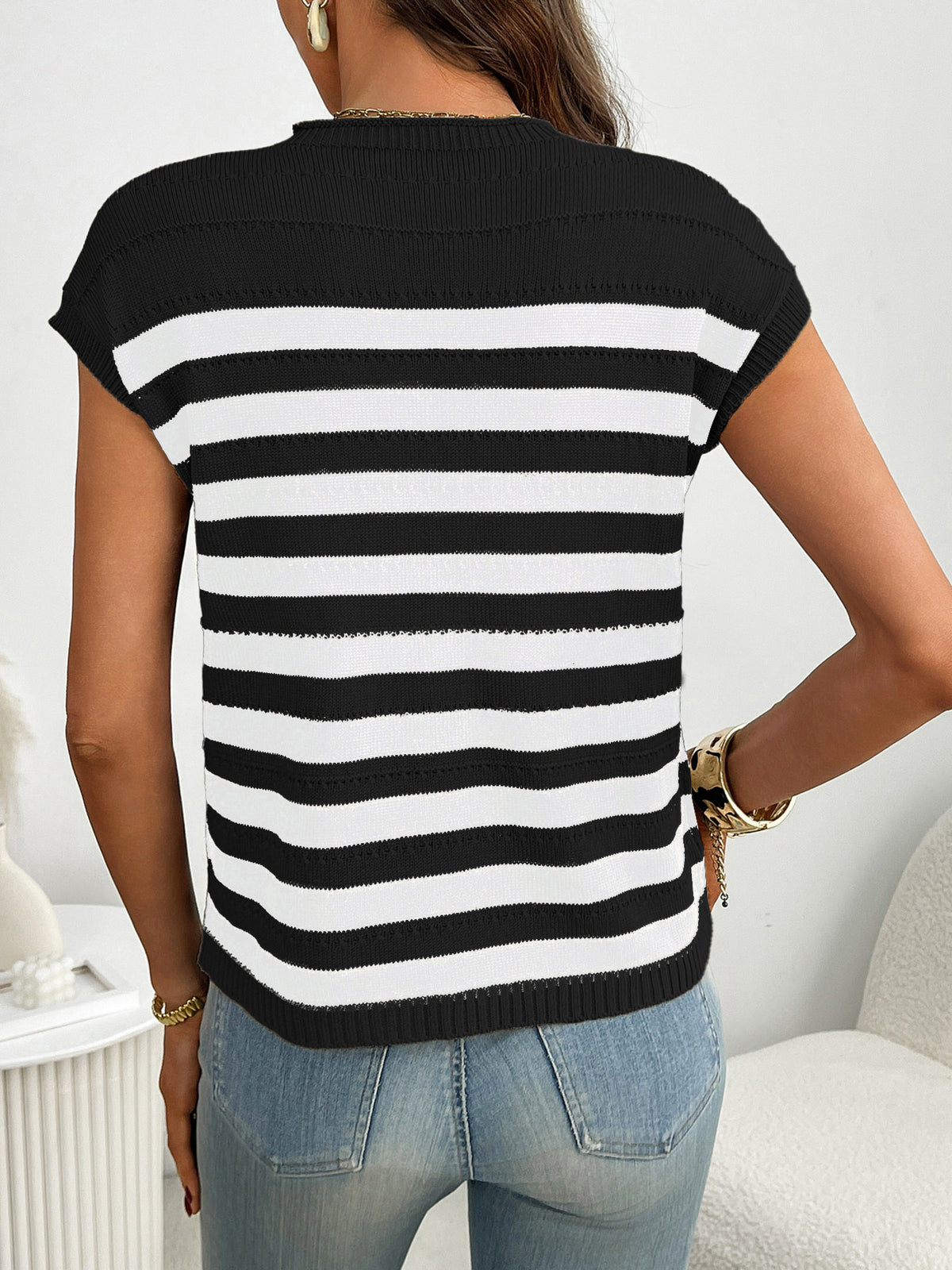 Women’s striped knit cap sleeve sweater with pocket detail, lightweight plush fashion outerwear perfect for casual wear.