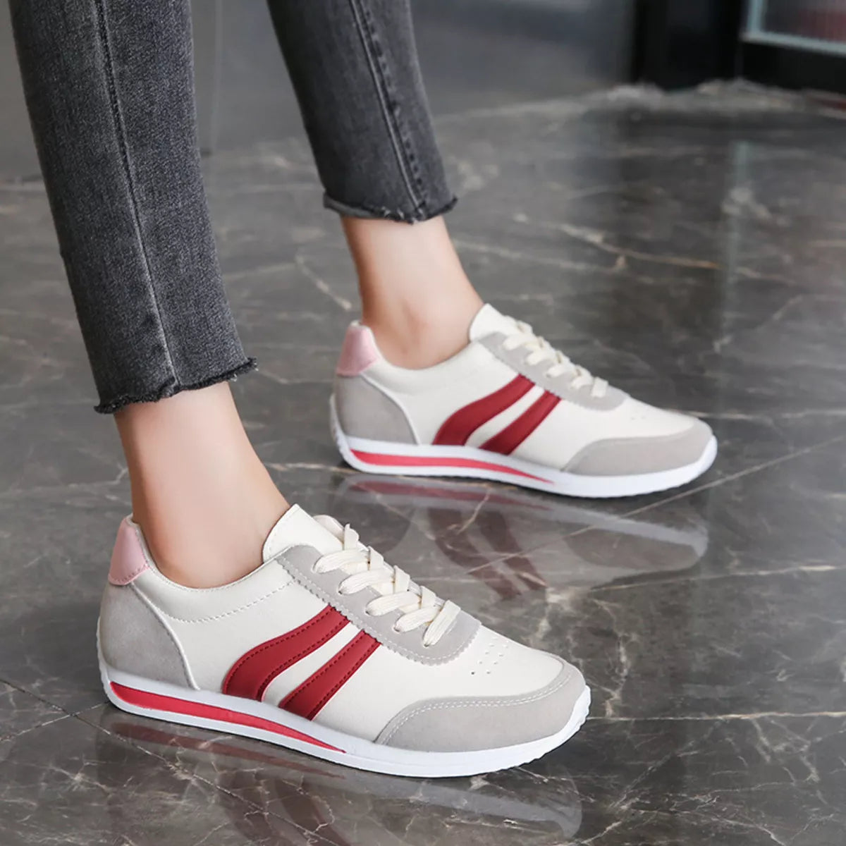 Women’s round toe lace-up sneakers by Trendsi, stylish casual sneakers with white laces and a comfortable sole.