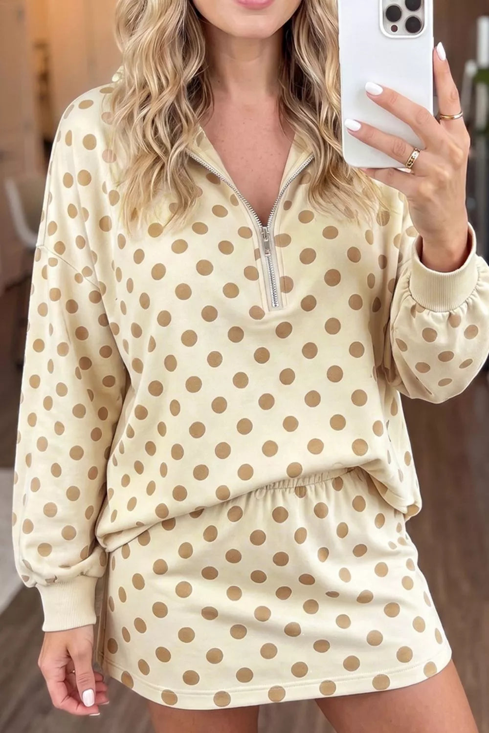 Polka dot quarter zip sweatshirt and shorts set for women by Trendsi, featuring a cozy, stylish matching loungewear ensemble.