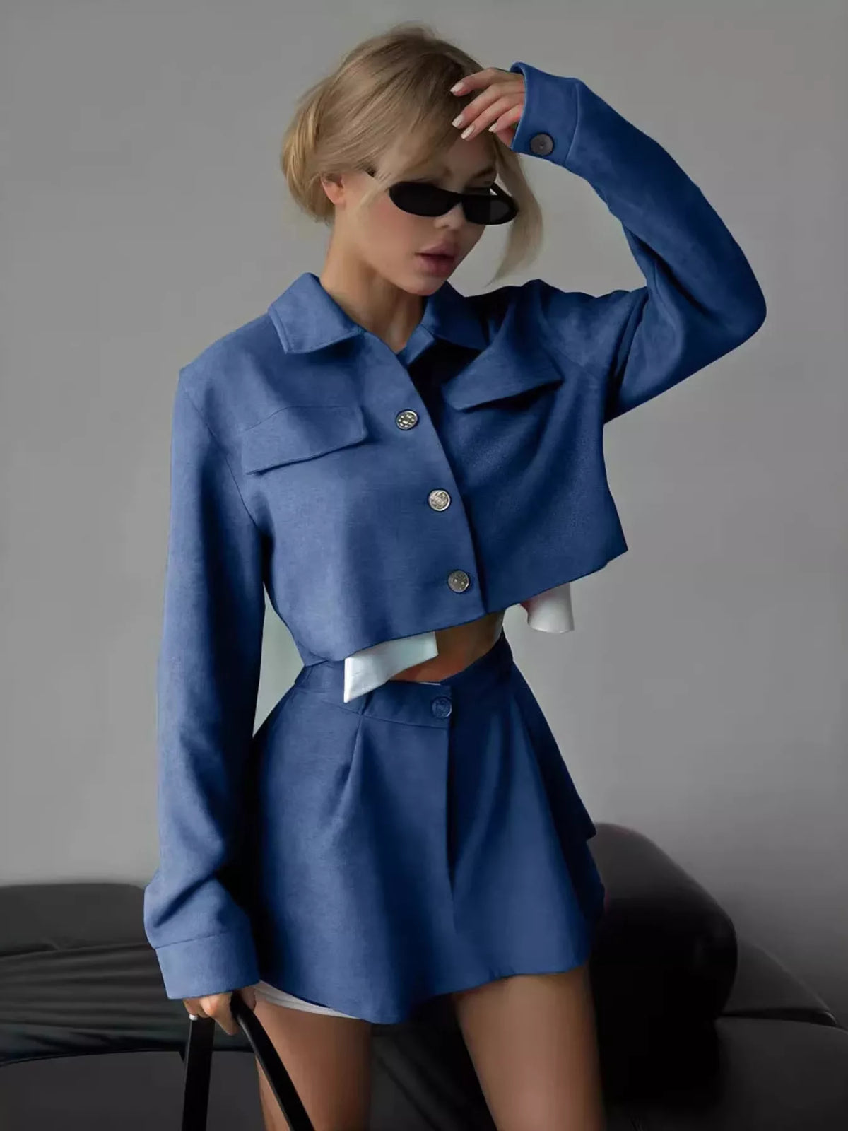 Trendsi cropped jacket and mini skirt set with button-up design, shown together on a model featuring stylish, coordinated fashion.