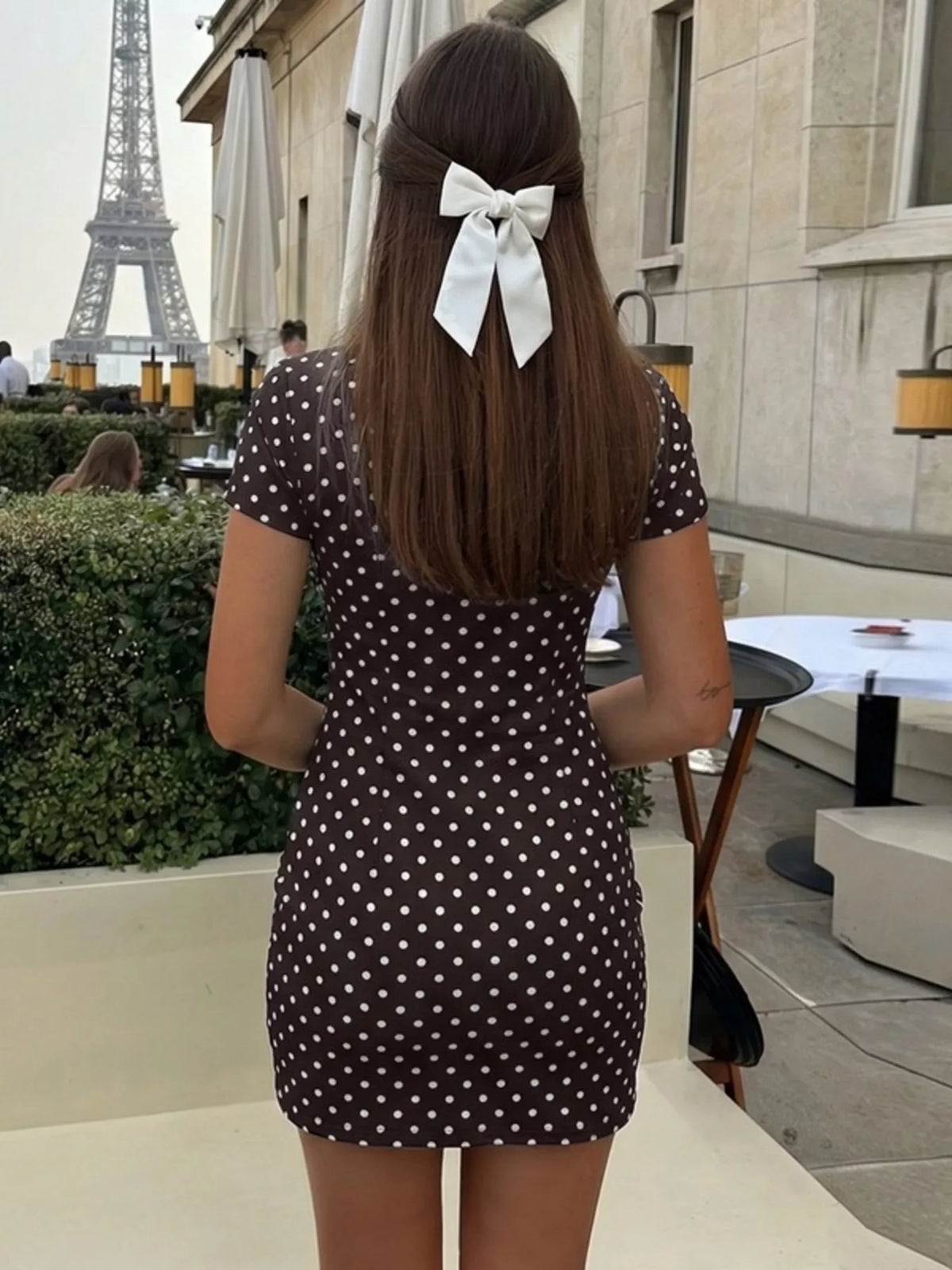 Polka dot cut-out front mini dress by Plush Fashion Hub featuring a stylish design and playful pattern, perfect for trendy occasions.