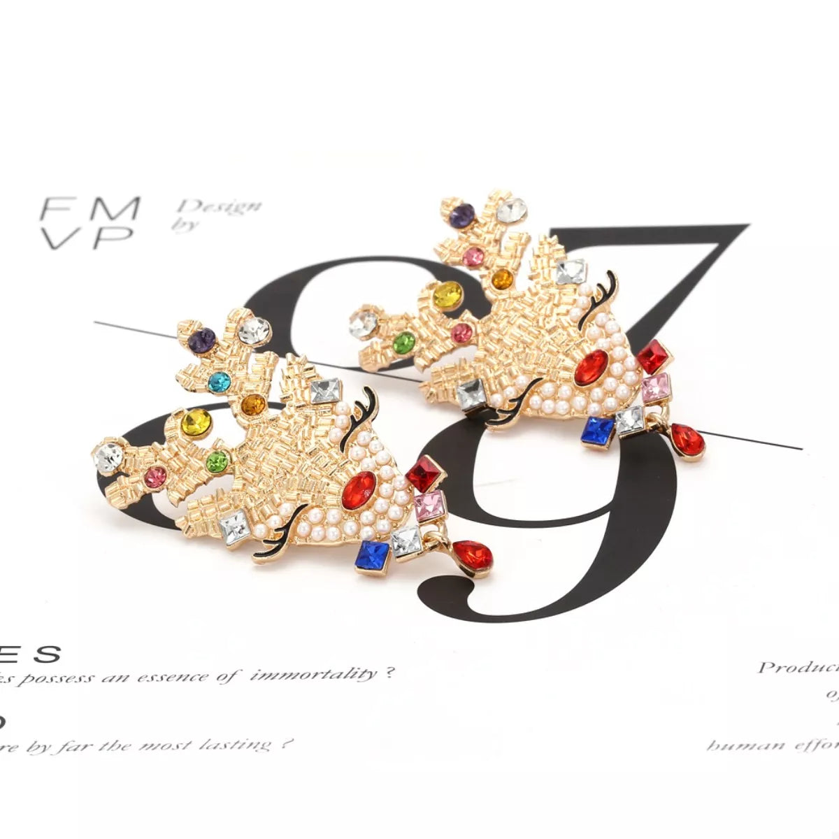 Sparkling Christmas Reindeer rhinestone earrings from Plush Fashion Hub, featuring festive reindeer design with shimmering rhinestones.