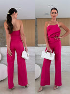 Candy-colored FitiqueFit bodycon halterneck backless jumpsuit with high waist and wide-leg design, perfect for casualwear.