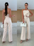 Candy-colored FitiqueFit bodycon halterneck backless high-waist wide-leg jumpsuit, casualwear with stylish design and vibrant fabric.