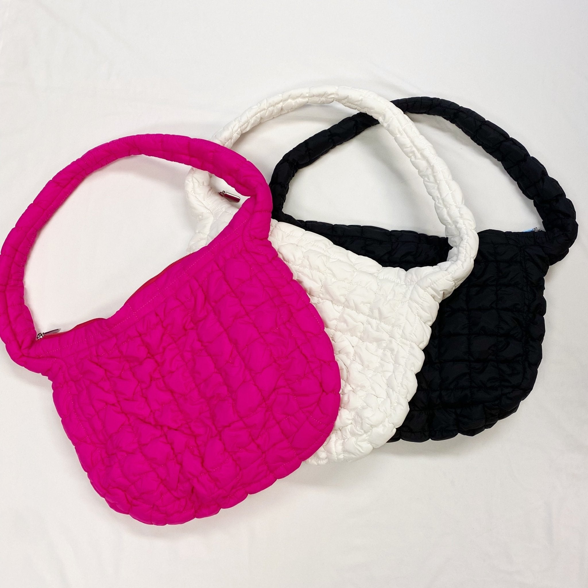 LadyShow.Store quilted cross body bag with spacious carry-all design, featuring a sleek, padded exterior and adjustable strap.