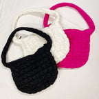 LadyShow.Store quilted Carry All cross body bag with adjustable strap and multiple compartments.