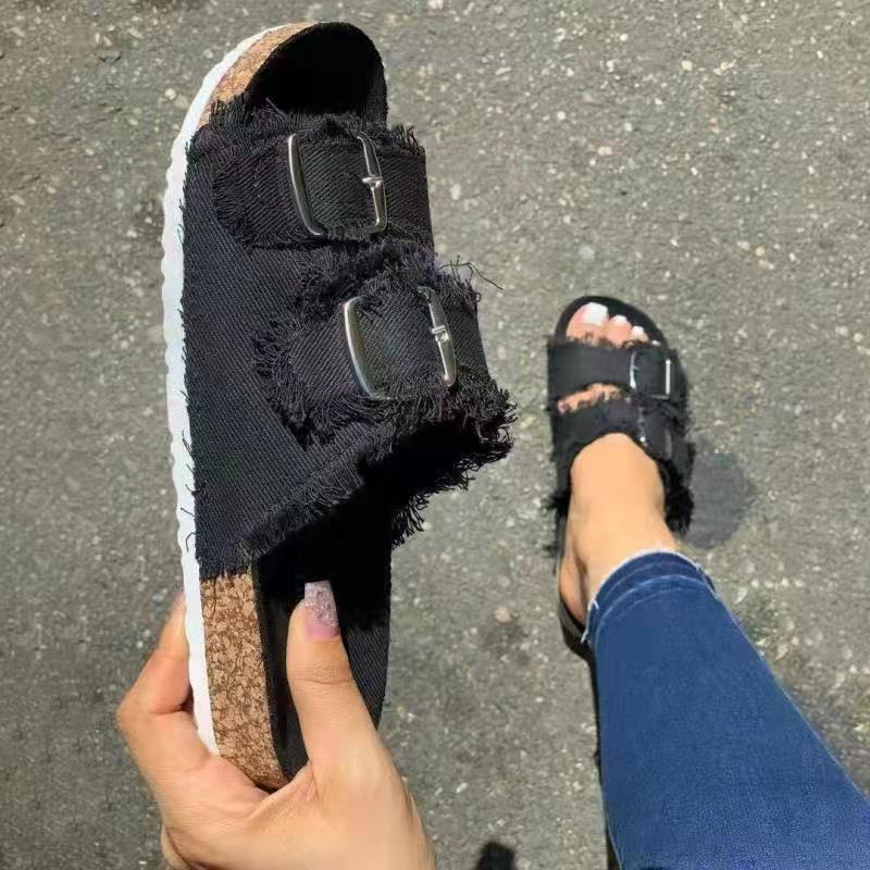 Casual solid canvas denim flat slippers with buckle detail, featuring comfortable slip-on design and trendy style.