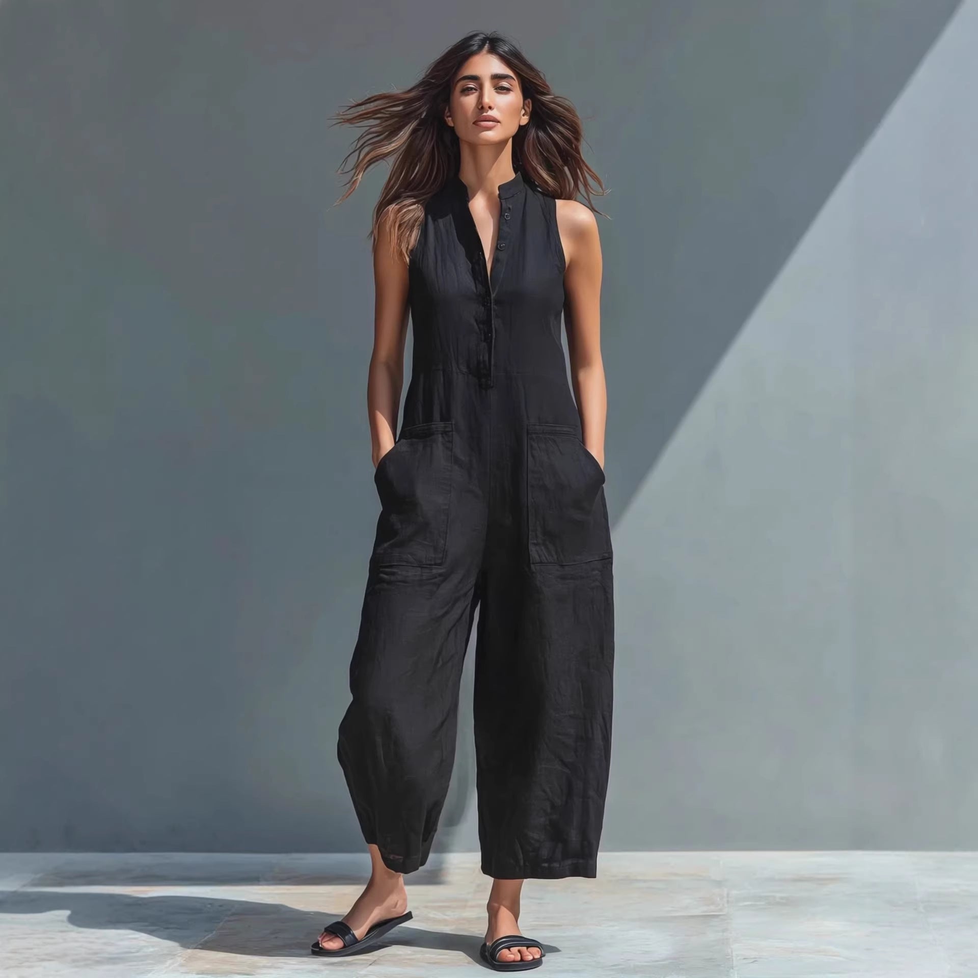 Casual women's sleeveless jumpsuit with buttoned stand collar and loose fit, by FitiqueFit, perfect for relaxed everyday wear.