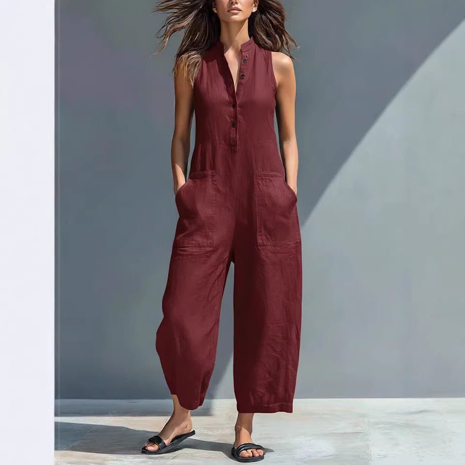 Casual women's sleeveless jumpsuit by FitiqueFit featuring a buttoned stand collar and loose fit, ideal for relaxed styling.