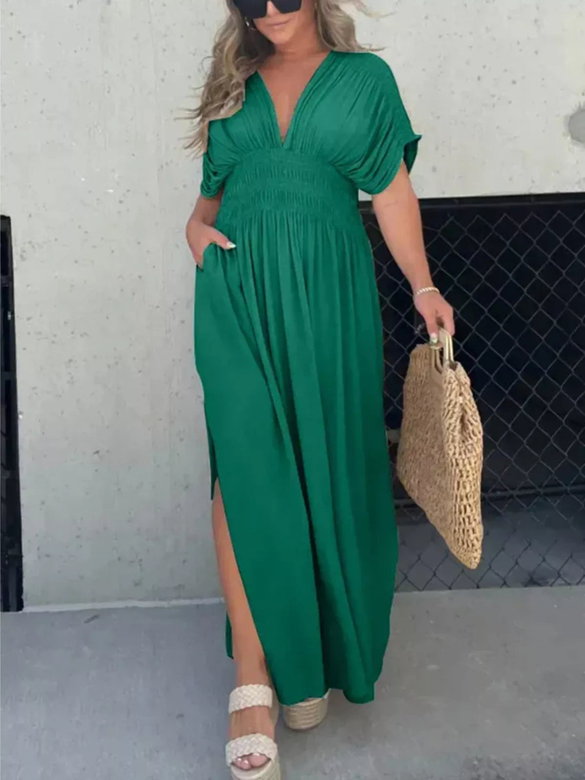 Plus size full slit V-neck maxi dress with smocked waist by Plush Fashion Hub, featuring flowy fabric and elegant design.