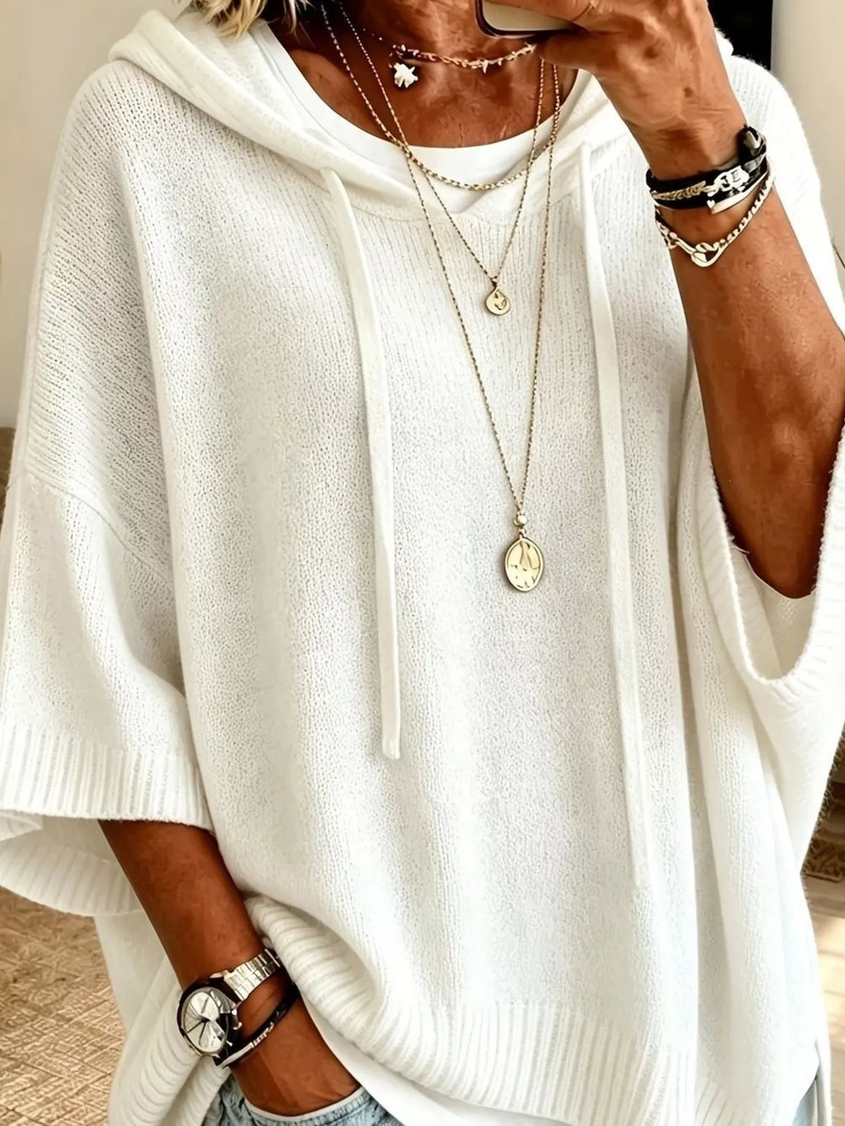 Plus size hooded sweater with drawstring, 3/4 sleeves, and cozy fit from Trendsi, shown in a full-size, casual style.