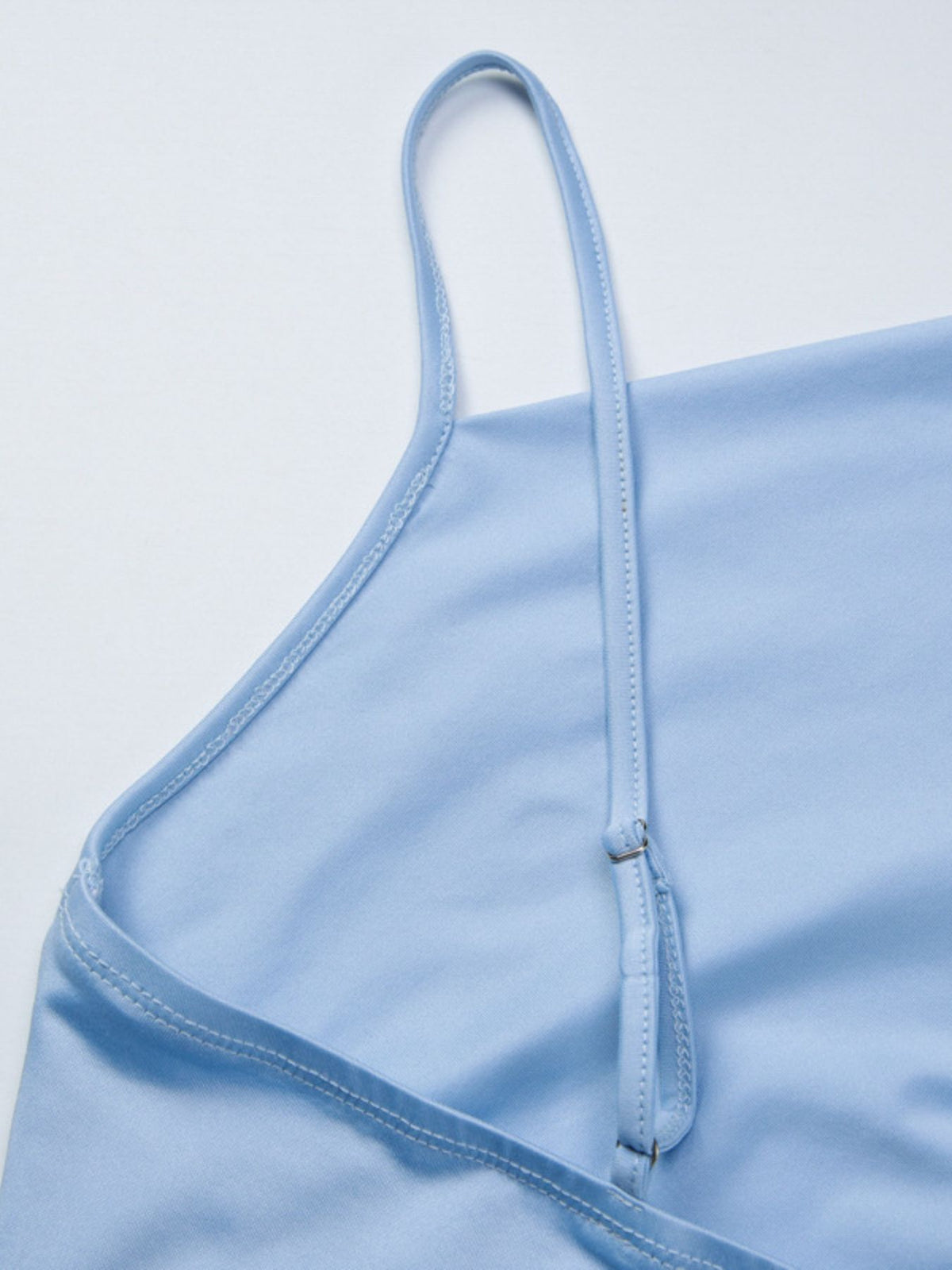 Women’s asymmetrical ruched cami top with tie detail from Plush Fashion Hub, featuring a stylish and feminine design.