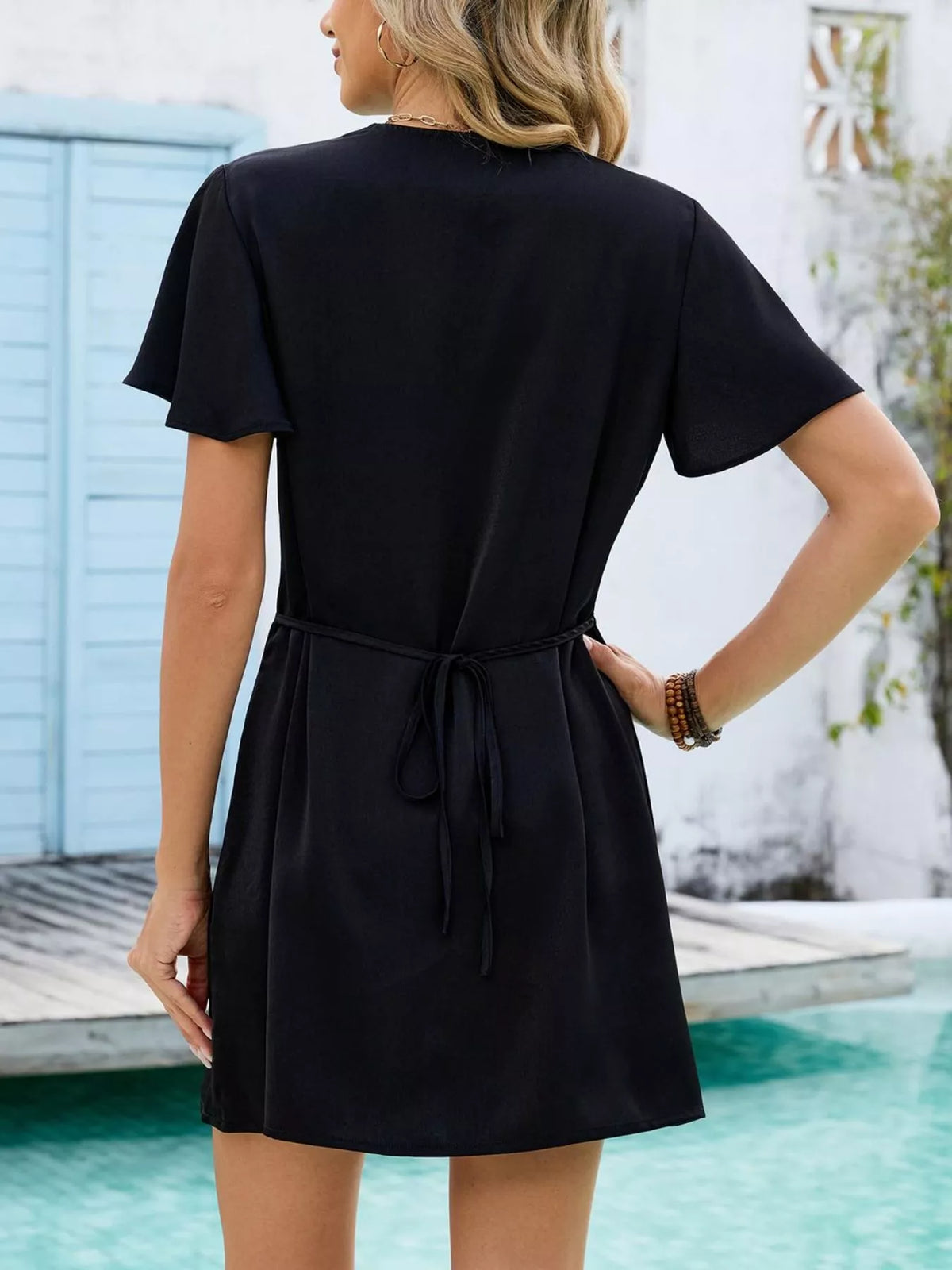 Women's casual summer shift dress with notched flutter sleeves by Plush Fashion Hub, featuring a relaxed fit and lightweight fabric.