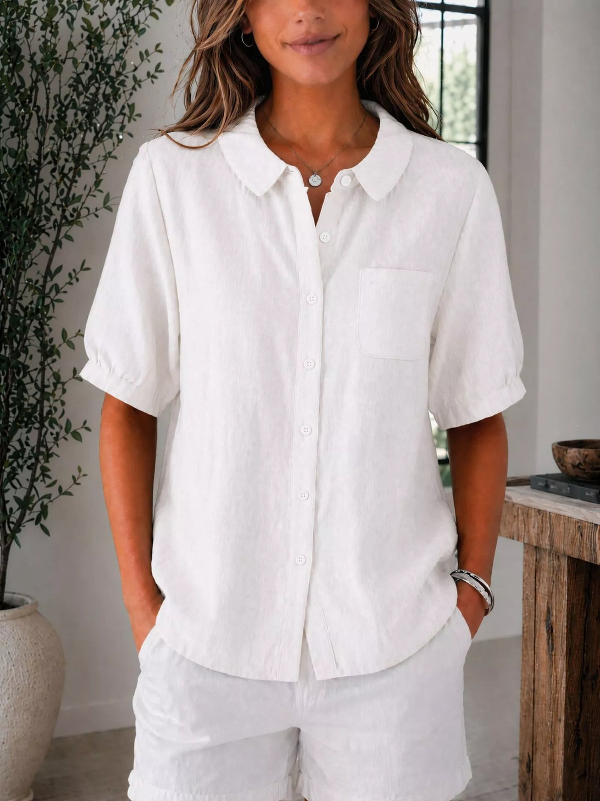 Plus size short sleeve button-up shirt from Trendsi, featuring a stylish full-length design and classic collar.