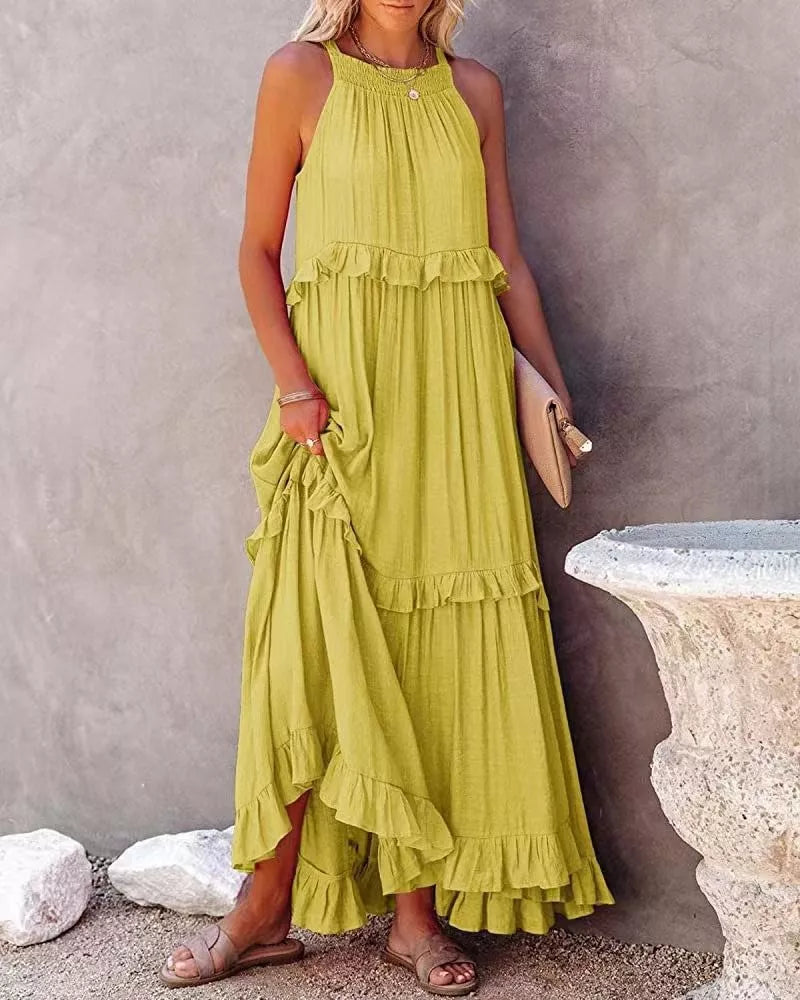 Ruffled tiered sleeveless maxi dress by Plush Fashion Hub with flowing fabric and layered design, perfect for summer wear.