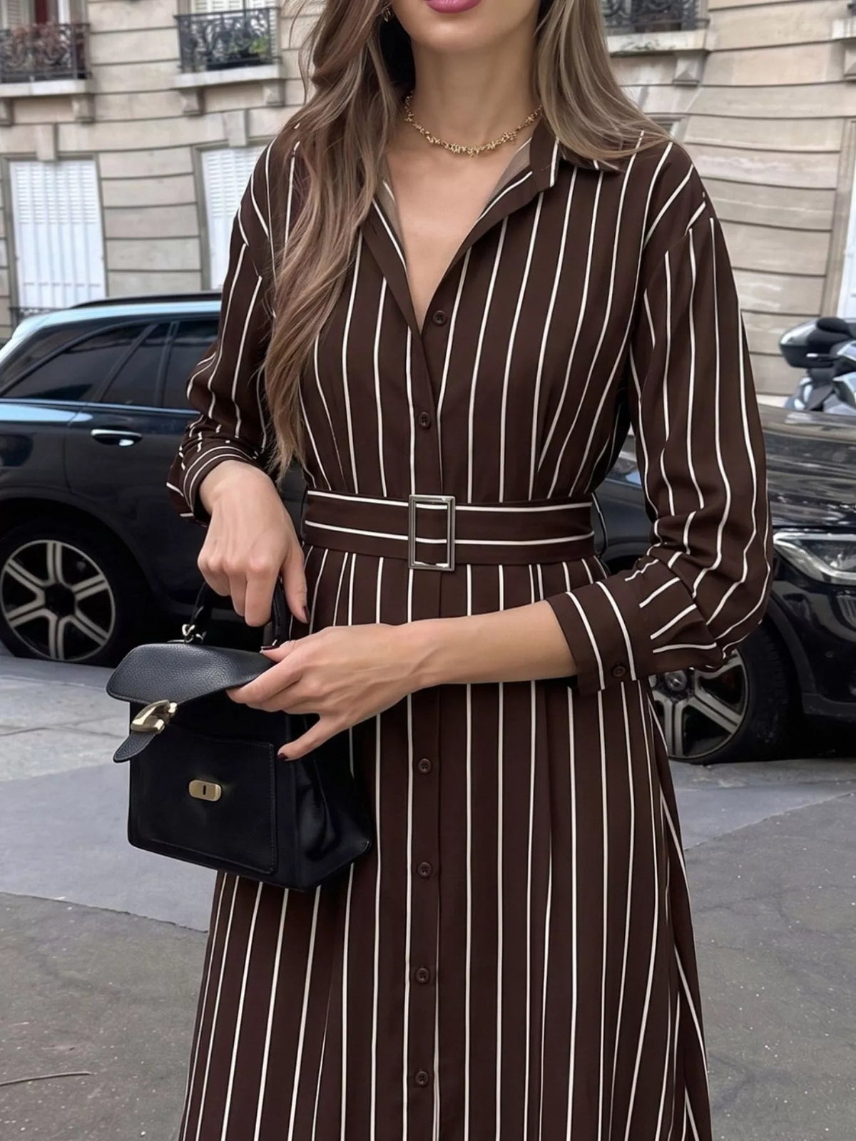 Women's striped long sleeve belted shirt dress by Trendsi, featuring a stylish belt and classic shirt dress design.