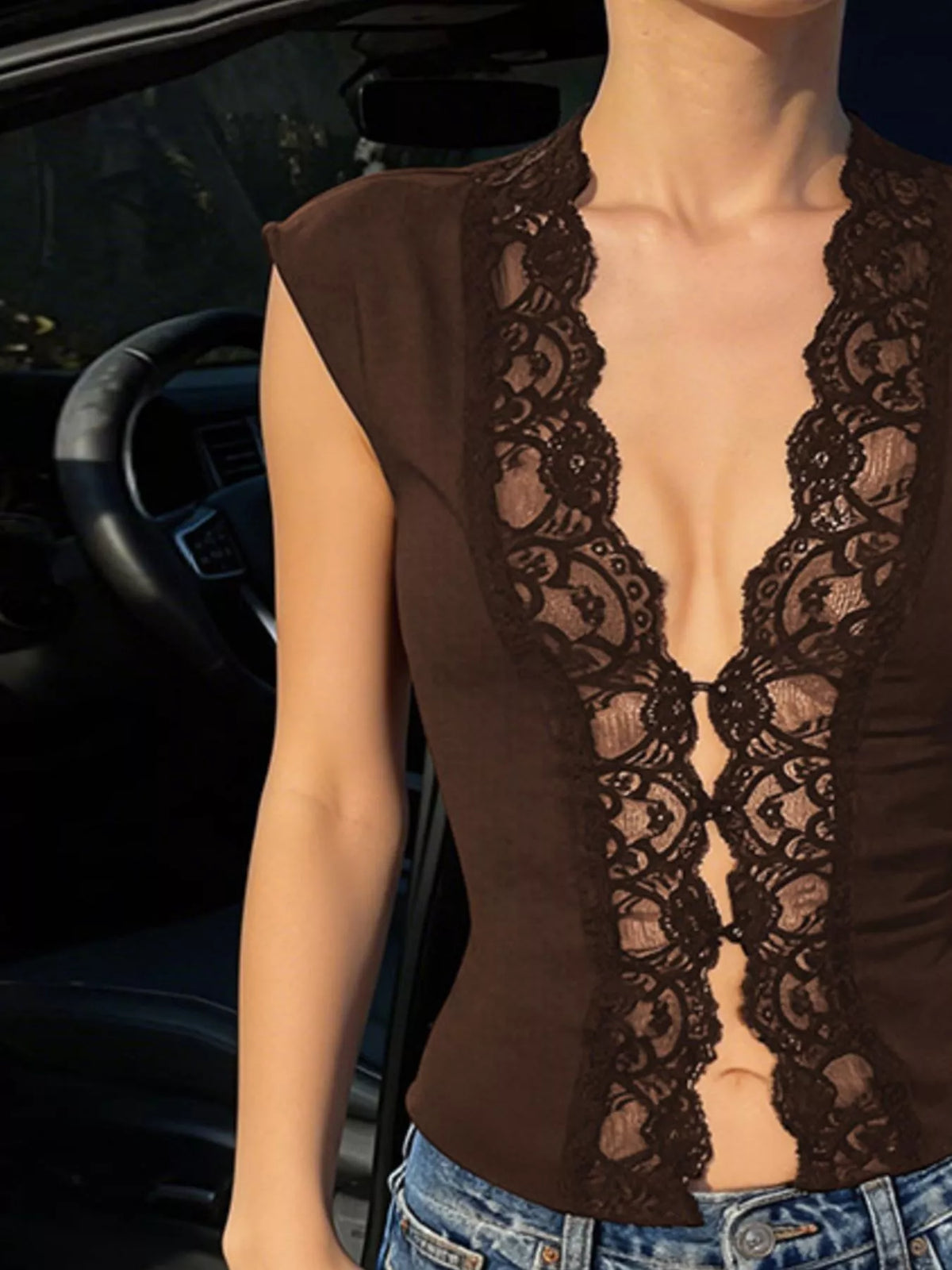 Lace trim button-front vest from Plush Fashion Hub featuring a sleeveless design and intricate lace details.