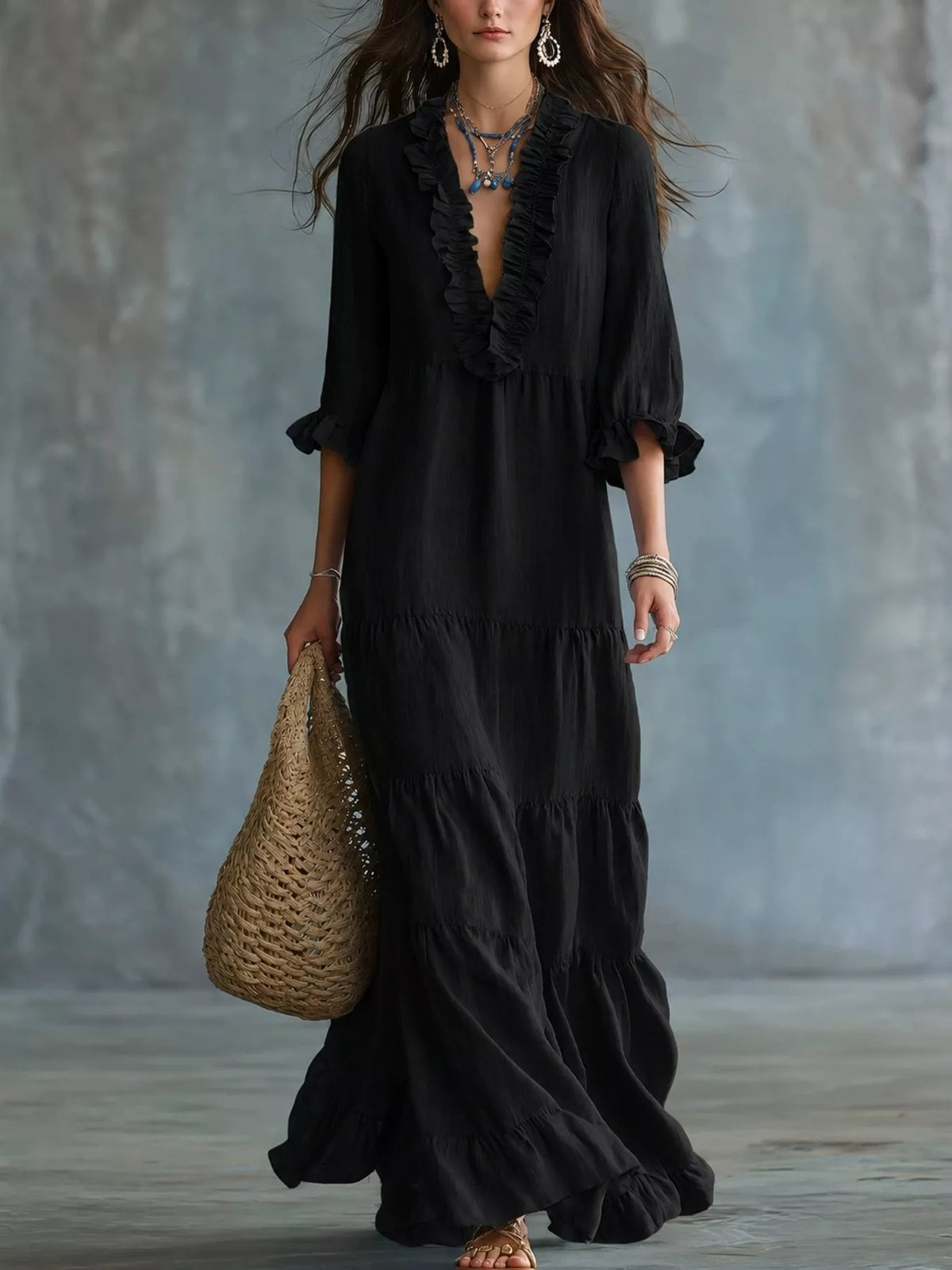 Ruffled V-neck tiered maxi dress by Trendsi featuring flowing fabric, ruffle details, and a flattering V-neck design.