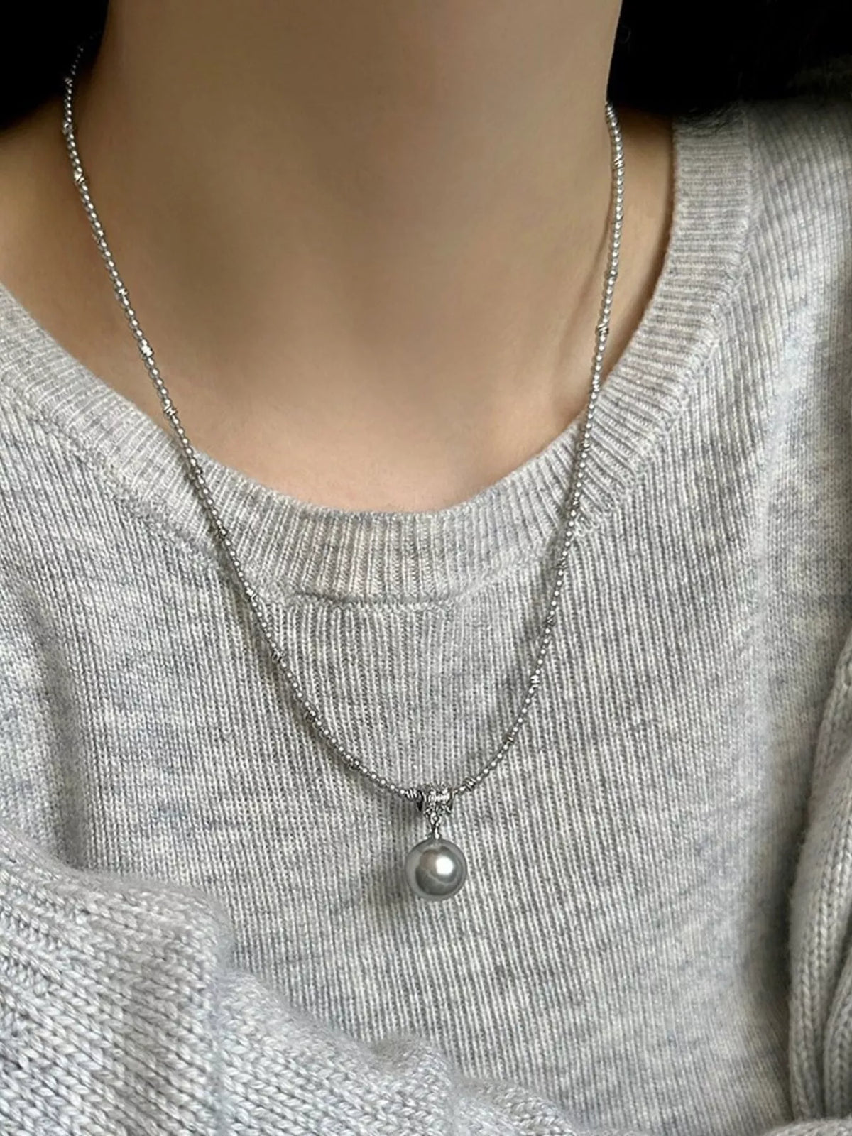 Elegant pearl pendant necklace from Plush Fashion Hub featuring a classic white pearl on a silver chain.