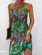 Women's printed sleeveless hollow dress by Trendy Attic Store01 featuring a stylish, flowy design and vibrant pattern.